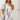 White striped tunic dress in 3XL size, featuring a casual knee-length design with a neutral summer style. The dress is shown on a fashion model highlighting details like shoulder, neck, sleeve, and waist.