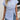 Blue and white striped twist-front blouse, casual chic top with long sleeves and a v-neckline, paired with jeans.