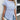 Woman wearing a blue and white striped twist-front blouse with long sleeves, casual chic style.