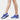 Blue slip-on mesh sneakers with air-cushion sole, designed for comfort and style, featuring electric blue accents; displayed on a human leg.