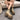 Stylish beige suede ankle boots for women featuring a chunky heel and buckle strap, showcasing their elegant and comfortable design on a wooden floor.