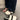 Stylish women's black platform orthopedic sandals featuring an ankle strap, displayed on a model's feet against a grey flooring background.