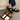 Stylish women's black platform orthopedic sandals with an ankle strap, featuring a modern design and comfortable fit, shown on a model wearing a dress.