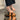Stylish women's black platform orthopedic sandals with ankle strap shown on a model's foot and lower leg, featuring a sleek design and comfortable fit.