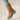 Stylish tan suede winter boots for women with shearling lining, showcasing a fashionable design and sturdy construction.