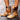 Tan leather knee-high boots with a contrast strap and rugged sole, shown in brown color, size 42.