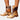 Tan leather knee-high boots featuring a contrast strap and rugged sole, highlighting a stylish fashion design and pattern.