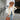 Teal long sleeve knit cardigan displayed on a mannequin, styled with a beige fedora hat and white eyewear, showcasing a trendy fall fashion layering piece.
