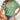 Woman wearing a textured olive green pleated blouse with short sleeves, styled as a casual summer top, standing with hands on hips.