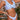 Trendy blue and white striped ruffled bikini set with high waist swimwear shown on model.
