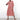 A woman wearing a red trendy geometric print maxi dress with long sleeves, featuring a boho chic fall fashion style.