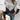 Trendy grey knit sweater with a V-neck and geometric color-block pattern, featuring long sleeves and a comfortable pullover design for women.
