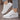 White low-top sneakers for women with gold accents, featuring a stylish and trendy design suitable for walking and fashion-forward outfits.