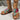 Tribal pattern women's sandals in a boho chic style, featuring vibrant pink and magenta hues, worn by a model showcasing summer footwear fashion.