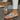 Tribal pattern women's sandals featuring a boho chic design, worn by a person with a focus on the footwear against a contrasting background.