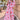 Tropical print maxi dress in pink, featuring a flowy design perfect for resort wear. The dress includes a high slit, off-the-shoulder style, and is available in size 2XL.
