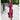 Tropical print V-neck wrap dress in pink and green, featuring short sleeves and a fitted waist, worn in a summer outdoor setting.