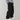 Men's black oversized cargo pants with multiple pockets, worn by a person showcasing their urban style.