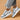 Vintage blue suede high sole sneakers for women, showcasing a retro fashion design. The sneakers are styled with grey accents and are ideal for walking or as a fashionable sportswear option. The image highlights the footwear against a neutral background.