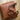 Vintage brown distressed leather tote handcrafted luxury bag with sturdy handles, displayed on a wooden surface.
