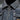 Vintage men's distressed slim fit designer denim jacket in grey, featuring a classic collar, long sleeves, and a textured denim material with a subtle pattern.