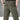 Water-resistant tactical cargo pants in a grey and beige color, designed with durability, quick-dry, and anti-tear features showcasing the waist, joint, and thigh areas.