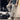A pair of water-resistant tactical cargo pants in a durable, quick-dry, and anti-tear fabric, shown on a person standing on asphalt with visible thigh and waist areas. The pants are designed as workwear, emphasizing functionality and ruggedness.