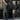 Black and grey water-resistant tactical cargo pants shown worn by a person, featuring a durable and quick-dry fabric with anti-tear quality.