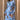 Whimsical blue maxi dress with colorful embroidery and patterns, featuring short sleeves and a defined waist, perfect for a cheerful and stylish day look.