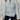 White cable knit zip-up sweater for women, showcasing a stylish autumn pullover design with long sleeves and a high neck.