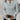 White cable knit zip-up sweater for women styled as an autumn pullover, paired with jeans, showcasing a fashionable look with a focus on the shoulder and neck area in a casual setting.
