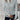 White cable knit zip-up sweater for women featuring a stylish design with long sleeves and a high neckline, ideal for autumn wear, displayed on a standing model.