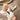 White embroidered women's western cowboy boots showcasing detailed stitching and fashionable design.