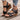 White floral wedge sandals featuring beaded straps and a cutout design.
