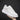 White leather low-top sneakers designed for minimalist comfort, featuring a sleek unisex design ideal for walking and sportswear activities.