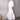 Mid-length white linen dress with a V-neck design, featuring short sleeves and a casual fit. The dress is ideal for summer wear and accentuates the waist while falling gracefully to the knees.