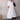 White linen V-neck mid-length dress with casual summer styling, featuring short sleeves and a flattering waistline.