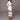 White long sleeve bodycon dress with sheer panel detailing and striped midi design, highlighting shoulder and waistline features.