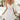White sleeveless backless A-line mini summer dress for women, featuring a flattering waistline and comfortable fit.