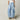 Wide-leg high-waist blue panel jeans with trendy urban comfort fit, featuring visible waist and knee detailing.