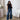 Casual chic outfit featuring wide-leg high-waisted jeans in denim paired with a neutral grey blazer with long sleeves and a classic collar.