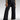 Woman wearing wide-leg high-waisted jeans and a neutral blazer, showcasing a stylish and casual chic outfit.