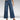 Model wearing wide-leg high-waisted jeans paired with a neutral blazer, showcasing a casual chic outfit.