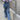 Wide-leg vintage denim overalls with a casual chic style, featuring a blue denim fabric, adjustable shoulder straps, and a relaxed fit through the legs.