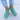 Women's aqua green lightweight slip-on breathable sneakers worn on a person's feet, showcasing a sleek design with azure accents against a white background.