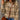 Women's Aztec quarter zip sweater with geometric knit design in a cozy boho style, featuring long sleeves and a high neckline. The sweater is primarily orange and designed for outerwear.
