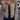 Women's beige corduroy jacket with button-up front and adjustable waist, featuring long sleeves and a classic collar, displayed in a fashion setting.