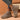 Women's beige high-top sock sneakers shown on a person, styled with jeans. The sneakers are designed for lightweight ergonomic comfort.
