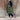 Women's beige hooded puffer vest, sleeveless winter coat, with front zipper closure, showcasing stylish design suitable for cold weather, modeled by a standing person.
