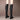 Women's black knee-high leather boots with a tassel and block heel, showcasing stylish and comfortable footwear for fashion-forward individuals.